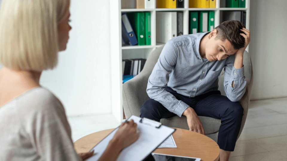 Man with psychologist theraphy