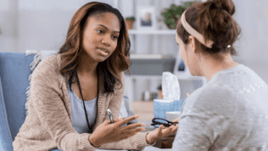 Young female counselor talks with client