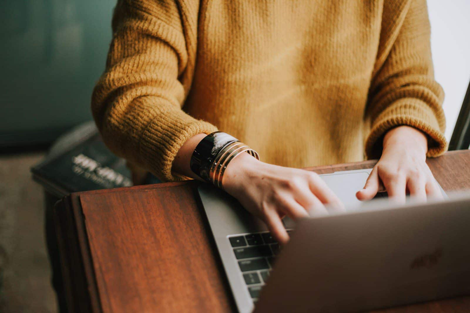 person using laptop for online counseling