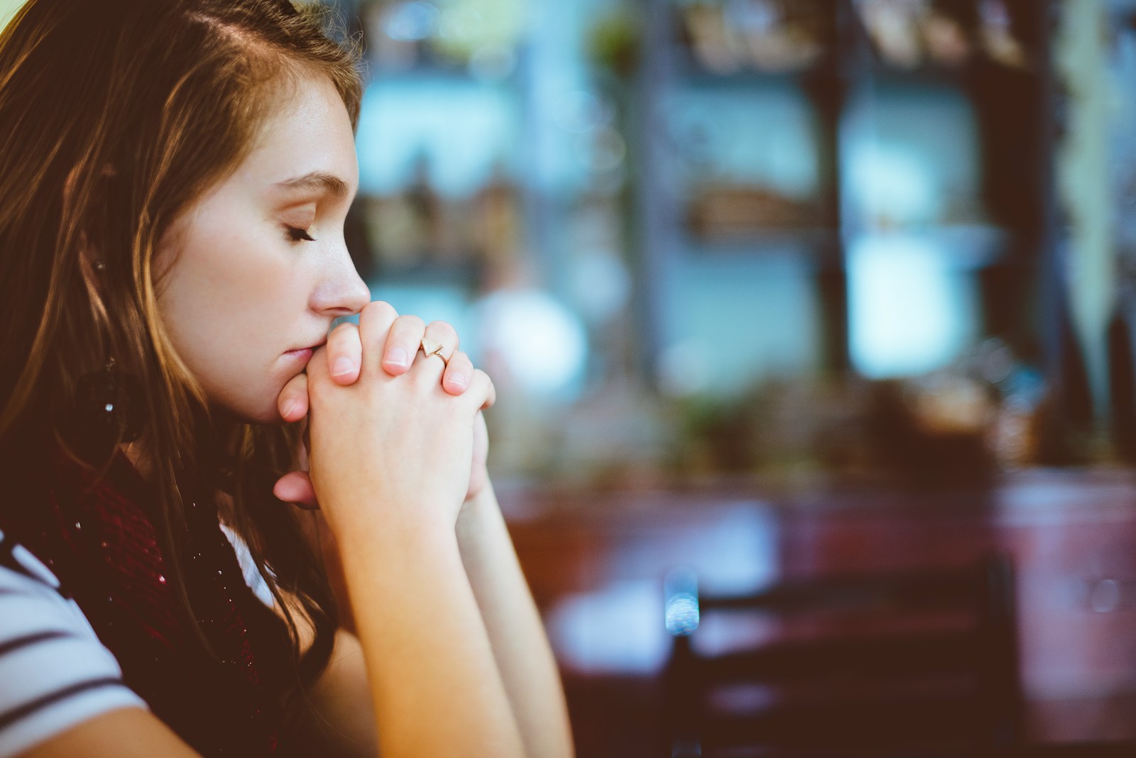woman praying - anxiety treatment