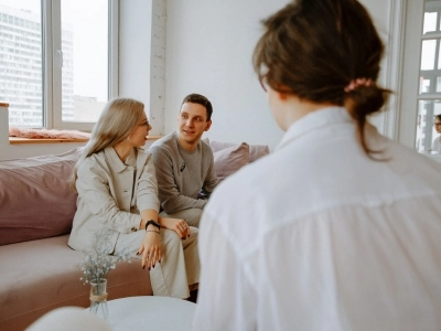 A male and female are attending marriage counseling led by a female therapist in Raleigh.