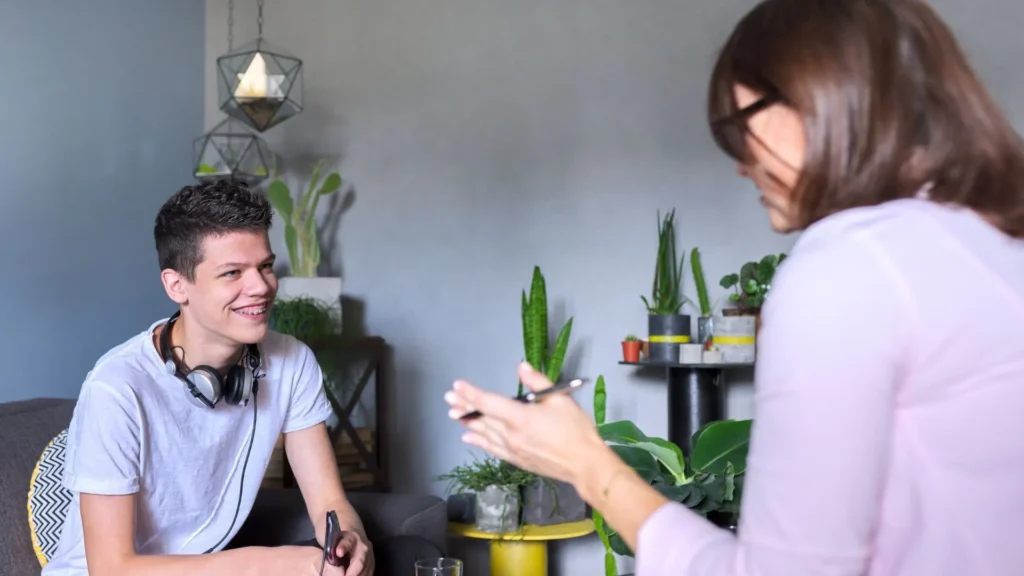 Teen therapy intake session with family therapist