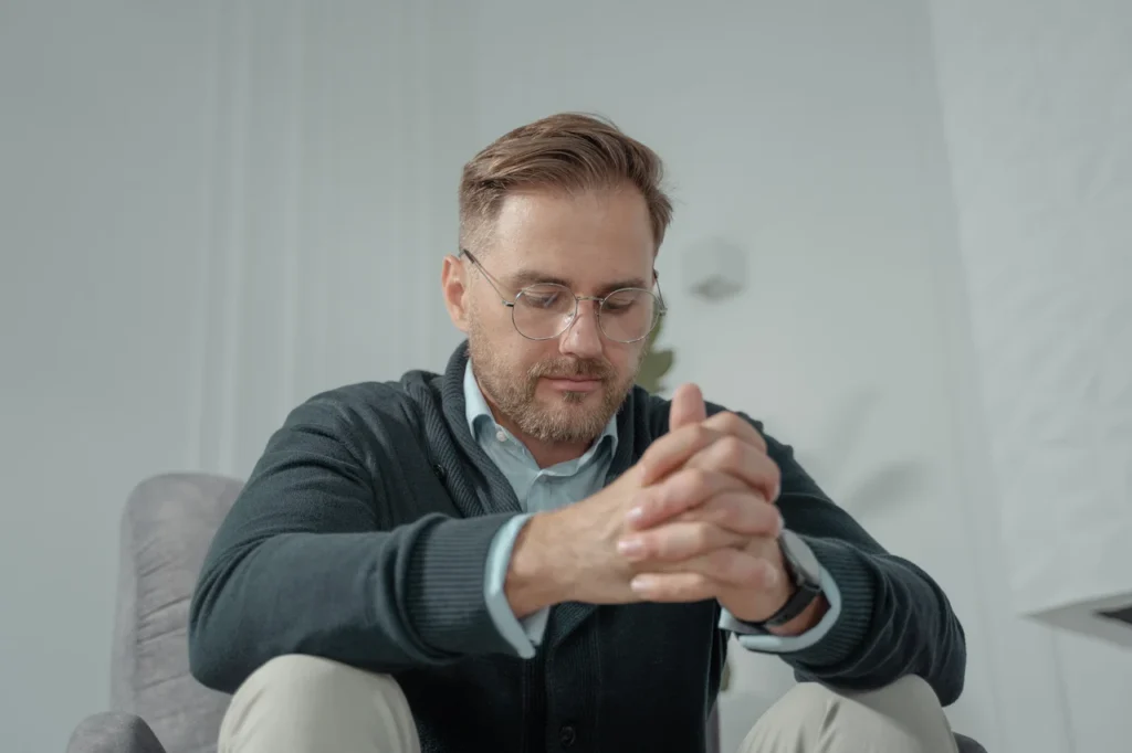 man-in-black-sweater-wearing-eyeglasses