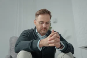 man-in-black-sweater-wearing-eyeglasses